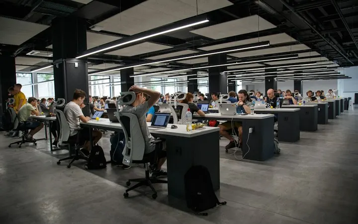 Open-plan corporate office with staff at their desks
