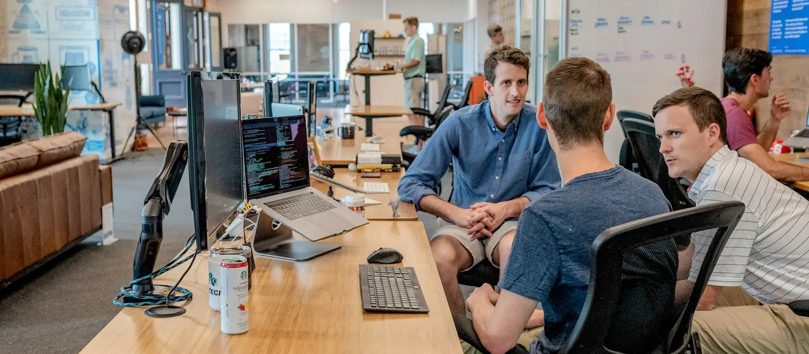 Team working together at desks with computers