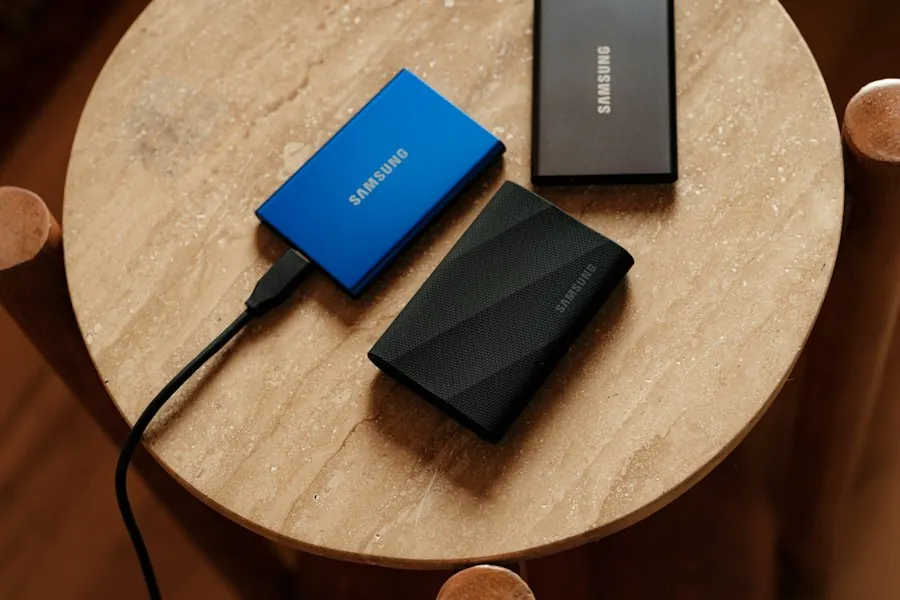 Portable backup drives next to a laptop